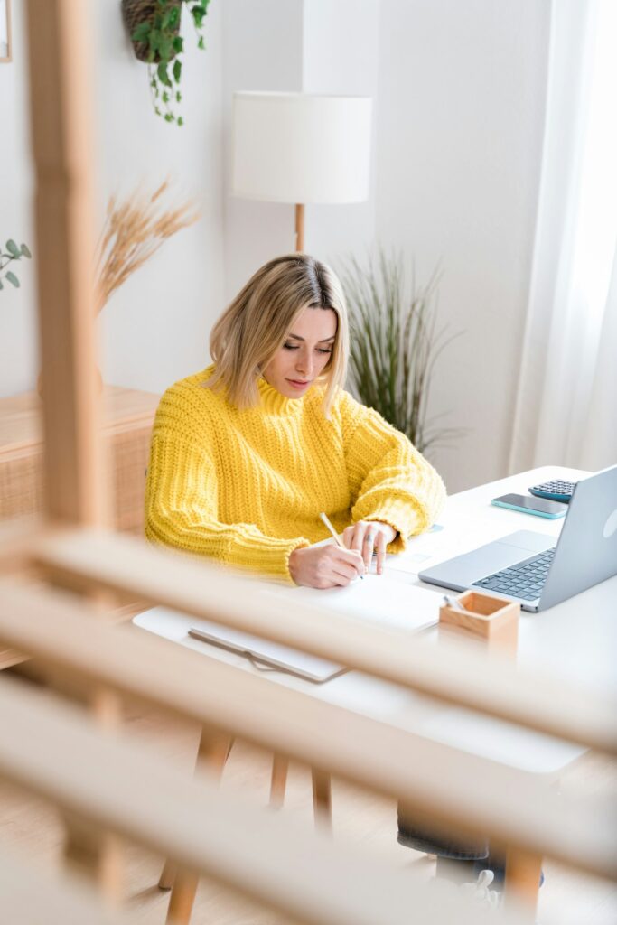 Focused woman working on laptop